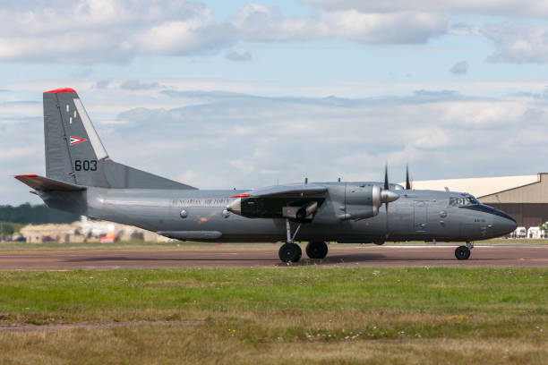Hungarian Air Force Antonov An-26 aircraft taxiing at RAF Fairford. Gloucestershire, UK - July 14, 2014: Hungarian Air Force Antonov An-26 military transport aircraft taxiing at RAF Fairford. antonov an 26 stock pictures, royalty-free photos & images