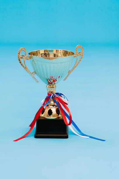 istock Golden trophy on blue background 1273817995
