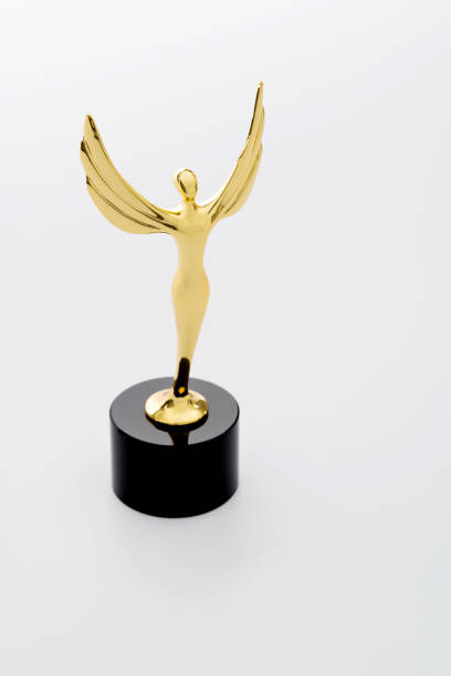 istock Gold figurine trophy on white background 1273819319