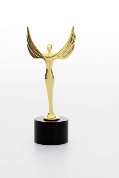 istock Gold figurine trophy on white background 1273819416