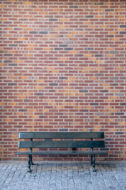 istock Brick wall and park bench. Loft background with copy space 1273820977