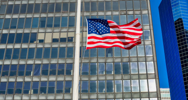 istock American flag flying in the wind skyscrapers 1273822125