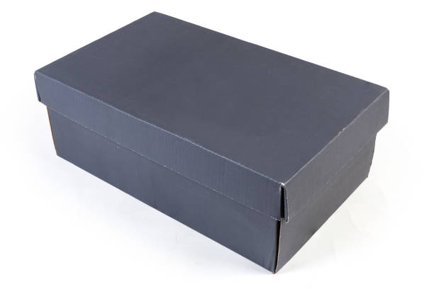 istock Closed dark grey cardboard shoe box on a white background 1273822560