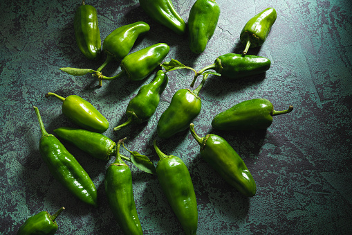 Pimientos del Padron are raw green Spain chili peppers vegan food on ingredient to prepare spanish Tapas