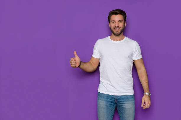 istock Handsome Man In White Shirt Is Showing Thumb Up 1273824057