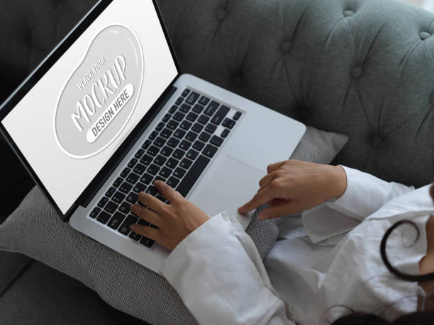 istock Female relaxing with mock up laptop while relax sitting on couch 1273825706