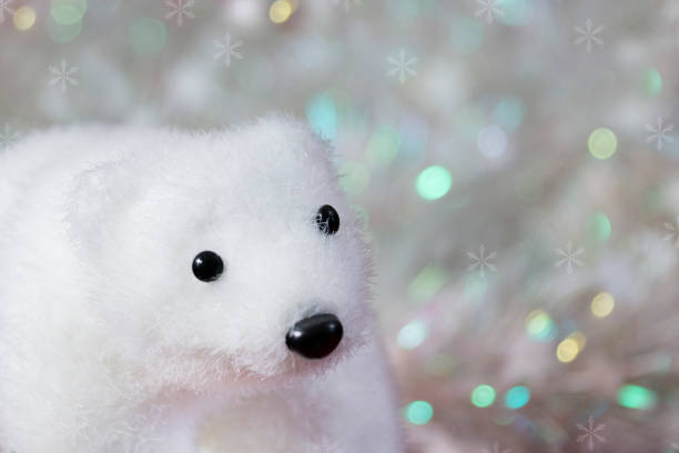 istock white teddy bear, christmas and new year decoration, on a silver background, bokeh 1273825709