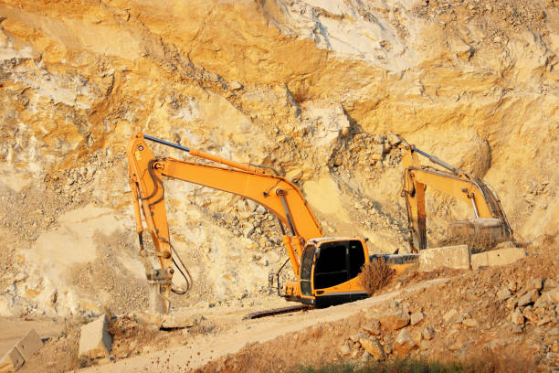 istock Crawler excavators works in a quarry 1273826139
