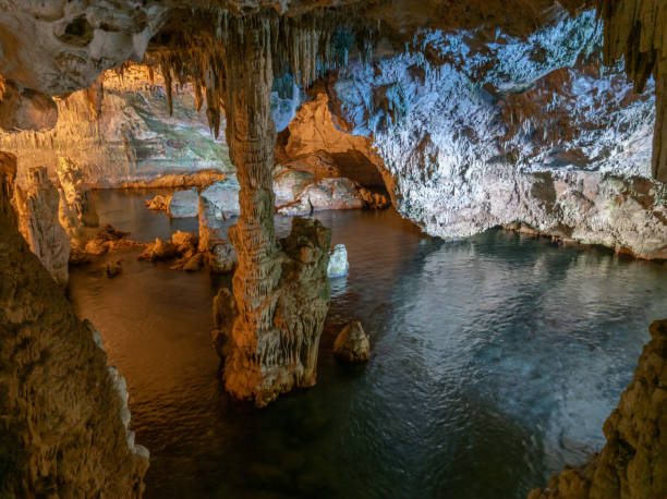 Neptune's Grotto in Alghero (Sardegna, Italy) Alghero, Italy - 31 August 2020 - The Neptune's Grotto ('Grotte di Nettuno' in italian) is a stalactite cave near Alghero city on the island of Sardinia. Here in particular a view of interior of cave. The visit is guided by the managing company, and for a fee with ticket. neptune roman god stock pictures, royalty-free photos & images