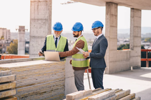 istock Photo of Teams engineer looking construction worker in a building site 1273827306