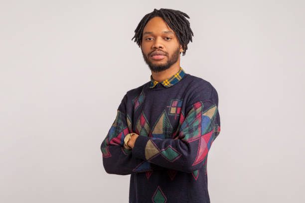 istock Concentrated african man with dreadlocks seriously and professionally looking at camera, assertiveness 1273827925