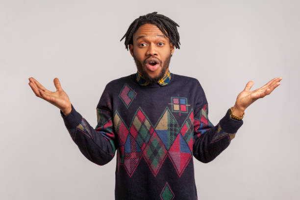 istock Oh my god! Extremely surprised wondered african man with dreadlocks spreading hands open mouth in shock, awesome success, victory 1273827941