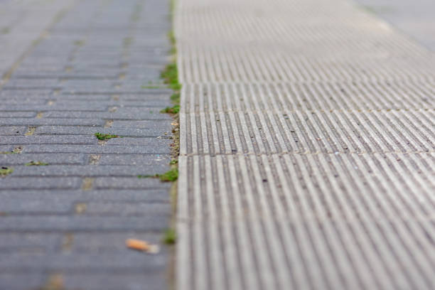 istock Two different textured lines of paving stones 1273828532