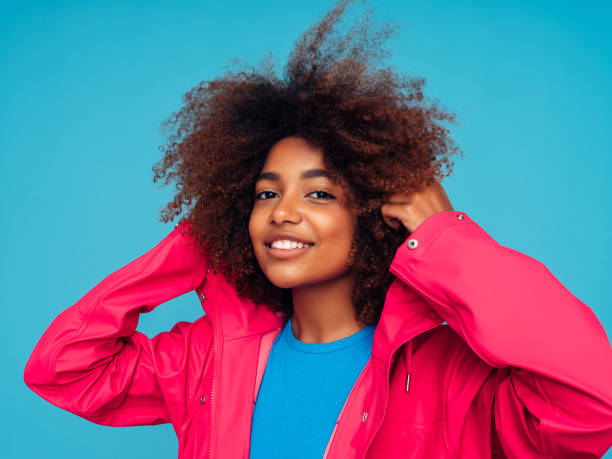 istock Young woman wearing raincoat 1273828543