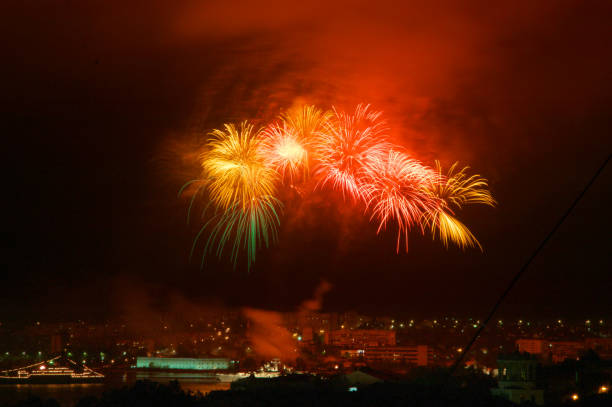 Holiday fireworks above night city.