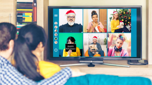 istock Multicultural friends celebrating Christmas online having fun on video call 1273833438
