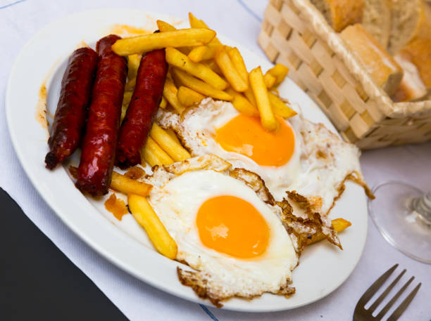 istock Huevos con chistorra. Scrambled eggs with sausage and potatoes. Spanish cuisine 1273834632