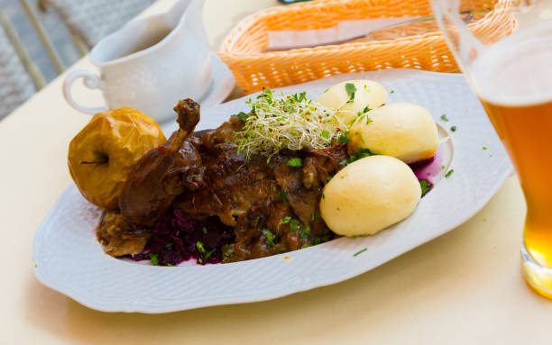Baked duck with blue cabbage and yeast dumplings