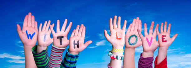 istock Children Hands Building Word With Love, Blue Sky 1273834971