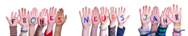 Children Hands, Frohes Neues Jahr Means Happy New Year, Isolated Background Children Hands Building Colorful German Word Frohes Neues Jahr Means Happy New Year. White Isolated Background baby new years eve new years day new year stock pictures, royalty-free photos & images