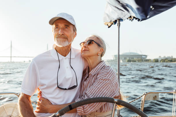 istock Elderly couple embracing on a private yacht while on vacation 1273836167