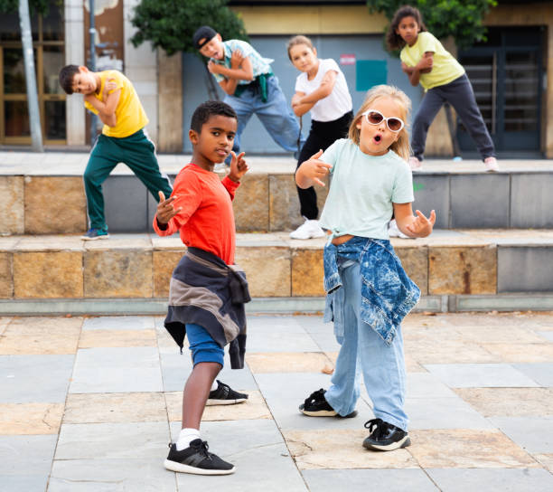 istock Modern tweenagers performing street dance choreography 1273836352