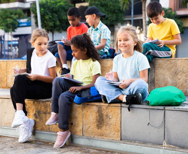 istock Group of kids having open air lesson 1273836384