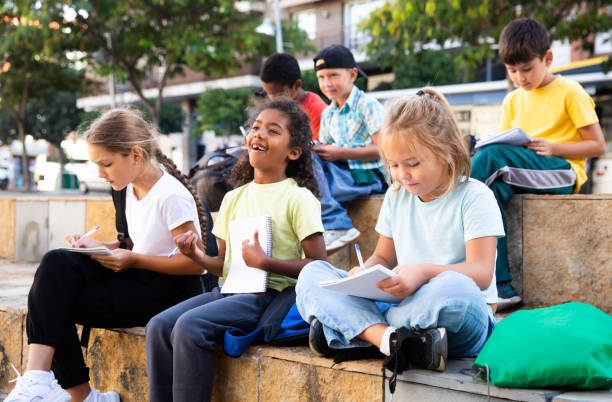 istock Group of kids having open air lesson 1273836388