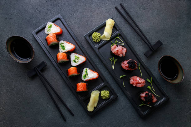 istock Sushi rolls on plate, gourmet seafood delicatessen 1273837650