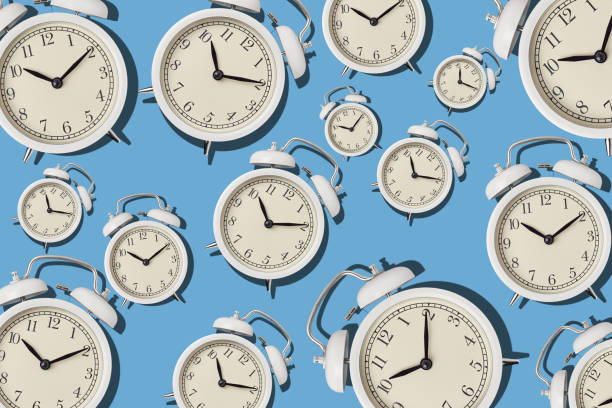 istock Vintage alarm clock pattern on a blue background, minimal style 1273838097