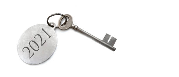 istock 2021 engraved on a ring of an old key on white background 1273839020