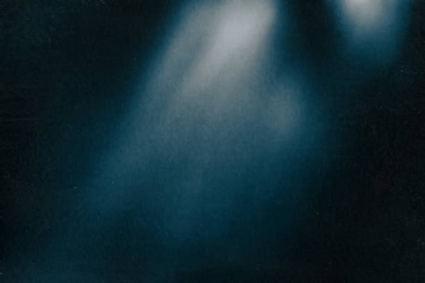 istock Distressed blurred abstract background light rays and spots on a dark blue 1273839031