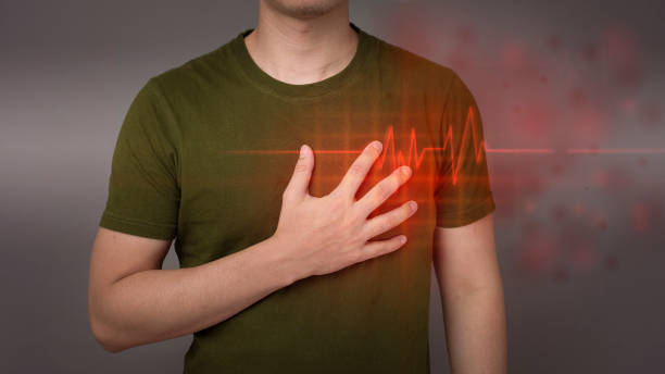 心臓発作を起こしている若者 - 心臓刺激伝導系 ストックフォトと画像