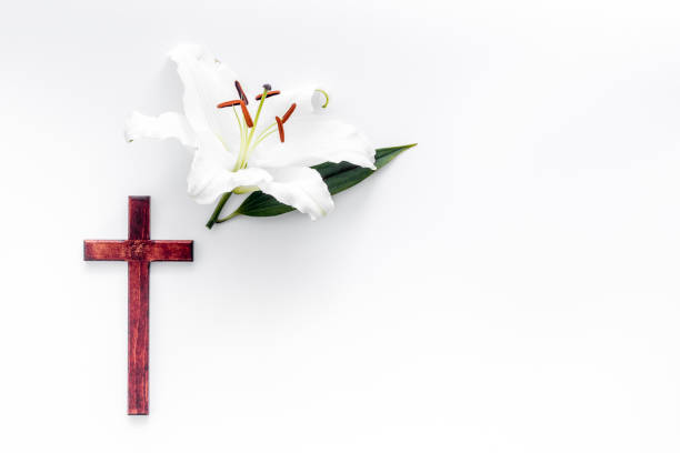 istock Condolence card with white flowers lily, from above 1273841289