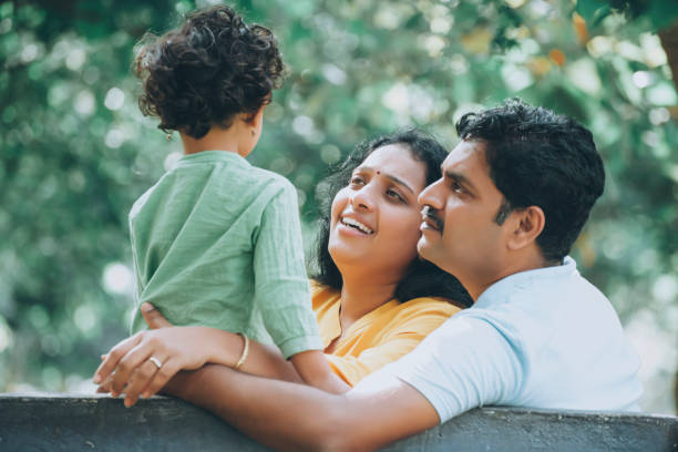 istock Family has fun playing in the park 1273842478