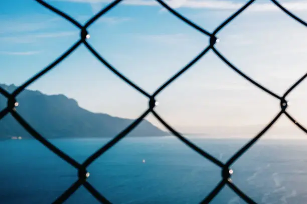 Photo of Lake Geneva behind the fence