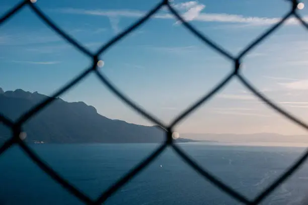 Photo of Lake Geneva behind the fence