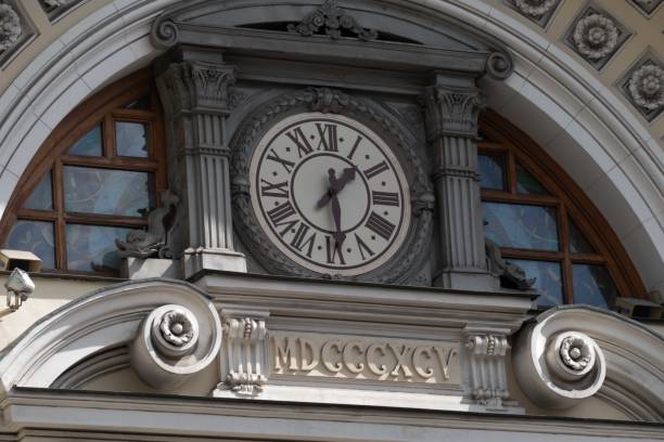 istock Ancient clock on the facade of the house 1273847006