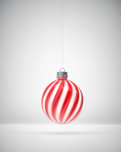 istock Glossy red and white twisted striped Christmas ball 1273847588