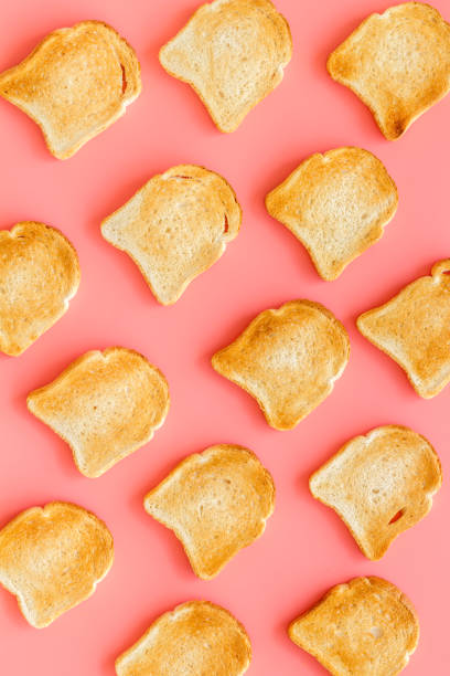 istock Slices of toast bread pattern. Food background. Top view 1273849676