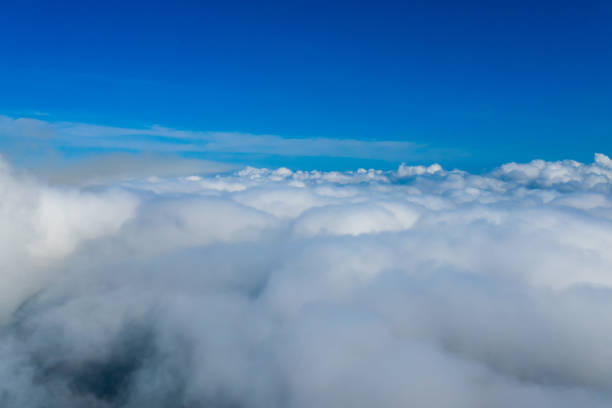 istock Many endless clouds in fantastic blue sky. Clouds below the sky. Cotton clouds under the sky. 1273850375