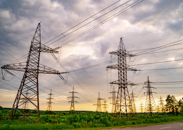 istock High voltage post. High voltage pylons against sunset background. Energy and industrialisation concept. Selective focus 1273850988