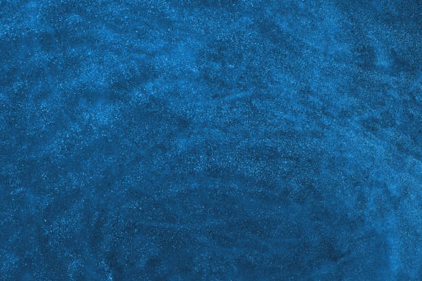 istock Abstract dark blue glitter shimmering holiday background 1273851269