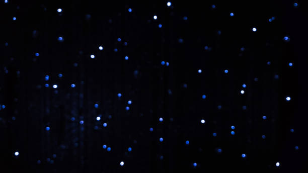 istock Blue blurred background of LED flashing, blinking and flickering bulbs. 1273851532
