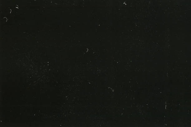 A close-up scan of an old scratched 35mm color film strip grunge texture background.