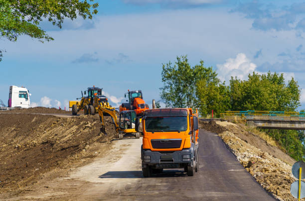 Large view on the road roller working on the new road construction site. Selective focus on road repairing. Closeup