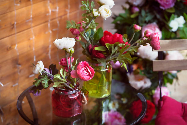 istock Blurred decoration artificial flower in the Glass vase on table 1273852535