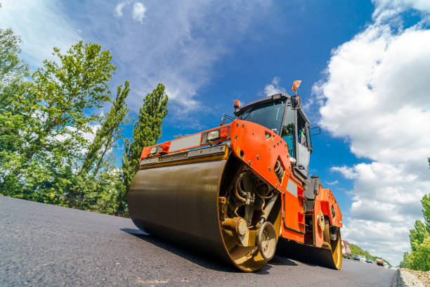 istock Road roller flattening new asphalt. Heavy vibration roller at work paving asphalt, road repairing. Selective focus. 1273852613