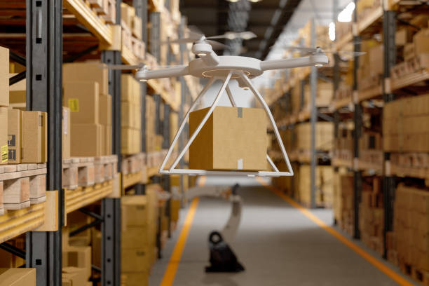 istock Drone Carrying The Cardboard Box In Warehouse 1273852716