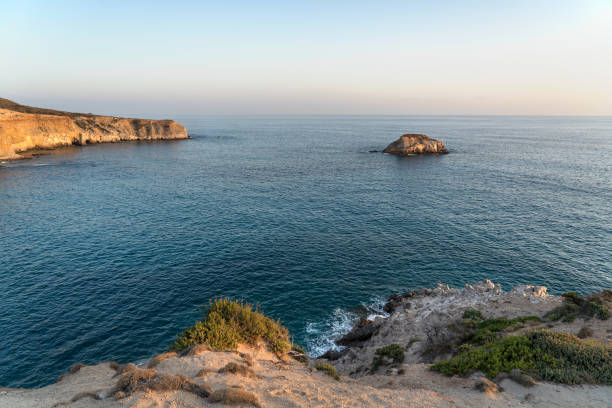 istock Rocky cliff over sea 1273853822